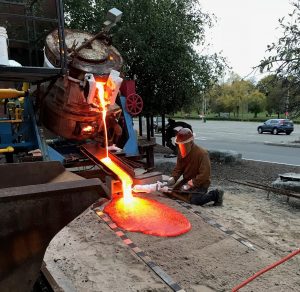 Artist Bob Wysocki pours homemade lava onto sand in Syracuse, New York.