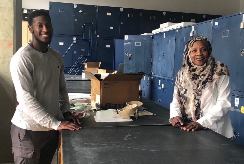 Carter Clinton (left) and Fatimah Jackson (right) at the W. Montague Cobb Research Laboratory at Howard University. The Cobb lab houses the largest collection of African American skeletal and dental remains in the world. Clinton is Assistant Curator and Jackson is Director of the lab. Credit: Lauren Lipuma. 