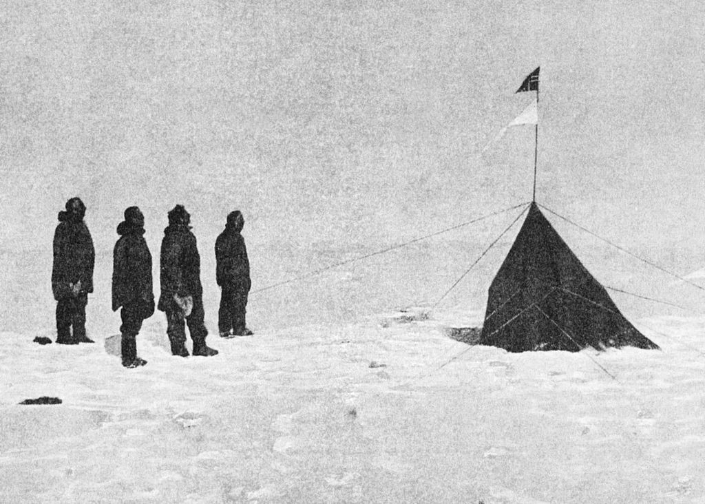 Roald Amundsen’s crew at the South Pole. From left to right: Roald Amundsen, Helmer Hanssen, Sverre Hassel and Oscar Wisting. New research shows warm weather and good conditions were a boon to Amundsen’s crew during their race to the South Pole but hindered the progress of Robert Falcon Scott’s crew across the Ross Ice Shelf. Credit: Roald Amundsen; public domain.