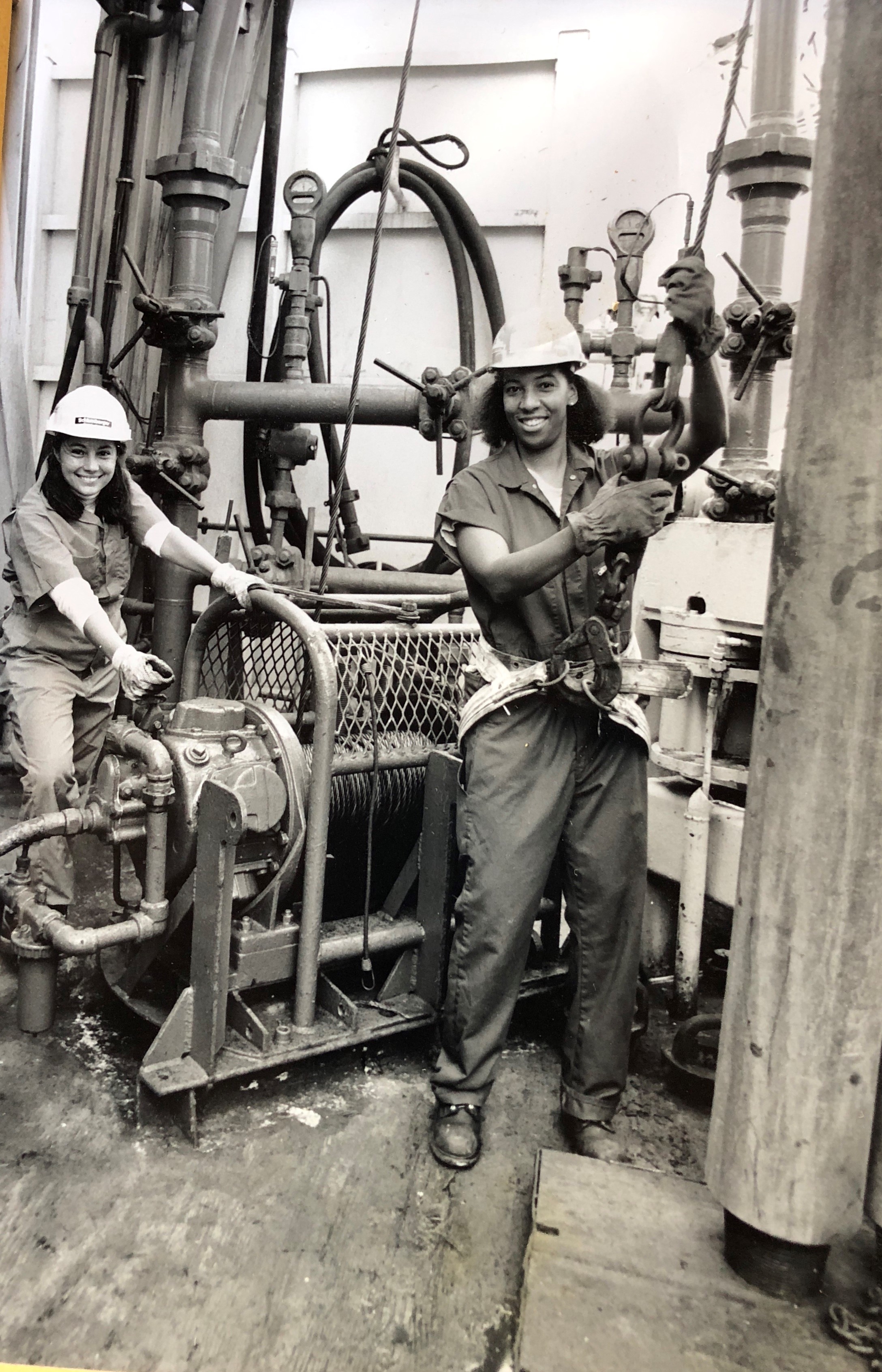 Photo of Dawn Wright (right) and ODP Staff Scientist Marta Torres (left) dressed as “roughnecks” aboard the drillship, taken during Ocean Drilling Program Leg 128 to the Japan Sea, August 21 to November 20, 1989. Port calls were Pusan, South Korea to Apra Harbor, Guam. This photo was taken toward the end of Leg 128, Dawn’s last leg as an ODP Marine Technician.