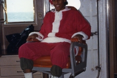 Dawn as Santa Claus allowed to sit in the Captain’s chair on the bridge of the JOIDES Resolution after distributing Christmas gifts around the ship. This was quite an honor as NOBODY sat in the chair but the Captain! Ocean Drilling Program Leg 119 to Prydz Bay, Antarctica, December 14, 1987 to February 21, 1988. Port calls were Port Louis, Mauritius to Fremantle, Australia.