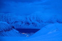 The small town of Longyearbyen is home base for researchers who study ice caves in Svalbard. Credit: Kiya Riverman.